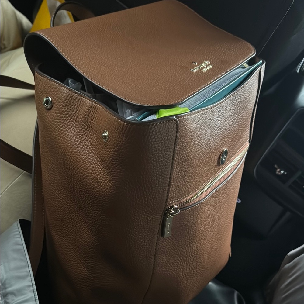 Brown Backpack with Structured Design and Secure Closure